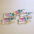Bullet-shaped crystal pendants featuring unique pink and green gradient glass effects - Pink Green Gradient
