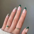 Minimalist gold rings with green gemstone inlay shown on hand with olive nails - Olive Green French Wave Style (JP1521)