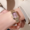 Close-up of rectangular gold watch with purple sunray dial and steel mesh band on wrist - Gold Pink
