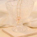 Fashionable gold three-petal flower necklace with pink gemstones on a glass display - 5# Pink