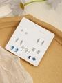 Detail of 7-pair silver stud earring set with blue enamel on a weekly display card - Mixed Color Leaves Planet Text (FX885-15)