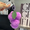Plush avocado keychain featuring purple pom-poms and green leaf charms on a metal ring - Lavender Grapes