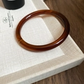 Detail of vintage amber resin bangle with retro tortoiseshell texture on ivory board - 61# Bracelet-Tortoiseshell Amber Round