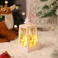 Close-up of white Christmas lantern with snowman patterns and warm LED light - White Snowman