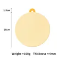 Pale yellow 16cm silicone heat resistant coaster with orange hanging loop and anti-slip texture - 16cm Heat Mat Gardenia Yellow