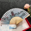 Classic folding fan with blue landscape painting, light wood ribs and matching blue tassel - Yellow Crane Tower - Light Blue
