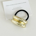 Minimalist black elastic hair tie featuring double-row glossy gold metallic cylinders - Double Layer Half Circle / Gold