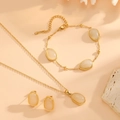 Detailed set of gold plated oval opal necklace, bracelet and earrings on elegant stones - White Jewelry Set (A520-A618-A620)