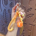 Portachiavi da tennis con cinturino intrecciato arancione e mini pallina - Arancione