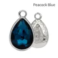 Peacock blue teardrop alloy pendant with multifaceted gem and star texture backing - Peacock Blue