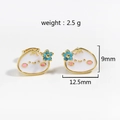 Detail view of cute white enamel bun stud earrings with blue flower and size specs - Gold