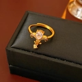 Macro shot of gold fleur-de-lis ring with teardrop zircon on a black leather jewelry box - Gold Water Drop (Real Gold Plating)
