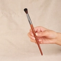 Concealer makeup brush with dark brown handle and silver ferrule on brown fabric - F242-Large Blending Nose Shadow Brush