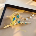Elegant gold butterfly hair claw with yellow blue wings and pearl tassels - Butterfly Blue Flower Tassel Pearl Claw