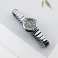 Close-up of Roman dial with crystal accents and luxury silver metal strap of women watch - Silver Black