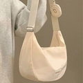 Minimalist beige nylon dumpling crossbody bag with matching round coin purse on wide strap - 24cm x 21cm x 11cm / Off White