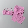 Detail von rosa nahtlosem Yoga-Set mit Cross-Back-Sport-BH und hoher Taillen-Leggings - S / Hellrosa