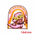 Detail of flower cowboy boot patch with sun flower and Take a walk on the wild side text - Pink Cowboy Boot