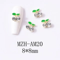 Macro detail of 8x8mm 3D cherry nail charms with green leaves and crystal fruits - Gold Base Medium Clear Cherry (AM20)