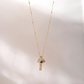 Golden MAMA pendant necklace with colorful zircon gemstones on a soft white backdrop - MAMA Letter / 18K Gold