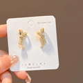 Elegant bow-shaped earrings featuring tiny white pearls and sparkling cubic zirconia stones - E4611-1 Gold Bow Pearl Inlaid