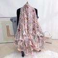 Pink paisley print large silk-feel shawl draped over a velvet chair in a bright room - 180*90CM / Pink