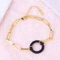 Detail of a gold plated link bracelet featuring a black crystal inset pendant and lobster clasp - Round Black Zirconia Bracelet
