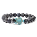 Labradorite beaded bracelet with a turquoise-colored sea turtle charm on a white background - Labradorite