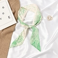 Beige and green skinny silk scarf with letter P pattern laid on elegant white silk cloth - Letter P - Beige Green Print