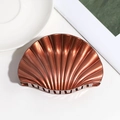 Close-up of a metallic brown shell-shaped hair claw with glossy finish and sparkling coating - Large / Orange Red