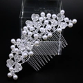 Close-up of silver hair comb with faux pearls and rhinestones on acrylic stand - Style 81258