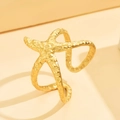 Golden starfish cuff bracelet with textured hammered finish on a minimalist background - J03419 / Gold
