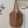 Brown woven cotton mesh tote bag in natural fiber hanging with a white t-shirt - Khaki