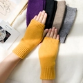 Knitted fingerless gloves in vibrant yellow featuring a soft wool texture for winter - Pumpkin Yellow