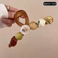 Pinza para el pelo ámbar de 13cm con flores preservadas y cuentas de resina - Pinza Grande de Flores Secas Café Transparente 13cm