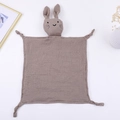 Close-up of baby muslin comforter with rabbit head design and soft knotted corners - 30*30 cm / Dark Khaki