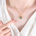 Golden titanium steel necklace with blue glass ocean fish pendant on model - P1539-Gold Necklace-40+5cm (Dolphin Wave Pendant)