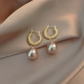 Golden twist rope hoop earrings with champagne pearl drops on a silk fabric background - #8 U-shaped Pearl Earrings