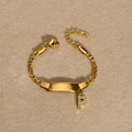 Gold stainless steel ID bracelet featuring a polished plate and crystal letter P charm - Gold Letter P