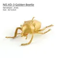 Realistisches goldenes Käfer Insektenmodell mit roten Augen und poliertem Metallfinish - Goldener Käfer