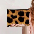 Leopard print canvas makeup bag with zipper closure held by hand against solid wall - Golden Brown Leopard Style (jiayingpbb0144)
