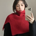 Close-up of red knitted turtleneck collar scarf on a model wearing a black jacket - High Neck Knitted Collar / Red