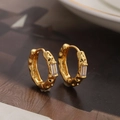 Minimalist gold hoop earrings with hammered texture and a rectangular zircon accent - Gold