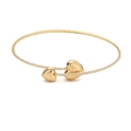 Macro detail of gold-plated bangle featuring heart charms and pave zircon stones - Gold Heart Necklace