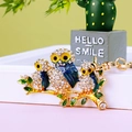 Golden rhinestone owl keychain with blue and green enamel hanging on branch charm - A430 Owl S Royal Blue
