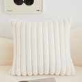Cream white faux fur lumbar pillow with striped texture on a cozy modern sofa - White