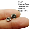 Macro shot of 8mm antique silver alloy spacer bead with relief pattern and 2mm hole - 23# (Dia 8mm Thick 3mm)