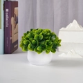 Detail of a green artificial plant in a white round pot for indoor desk decoration - Small Green Leaf - Round Pot