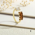 Detail of gold open ring featuring clear and amber rectangular zircon crystals on a white base - Adjustable Open / Amber And White Stone Style (RG0628-E)