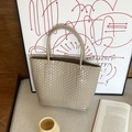 Handwoven khaki straw tote bag with dual handles in a minimalist vintage summer style - Small / Beige